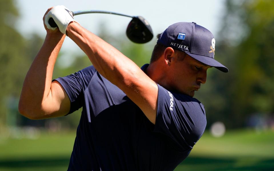 Bryson DeChambeau hits his tee shot on the ninth hole during final round at the Masters golf tournament at Augusta National Golf Club Sunday, April 14, 2024, in Augusta, Ga