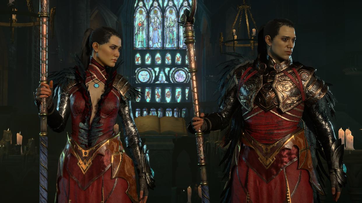  Sorcerers standing side by side, wearing matching red and gold outfits 