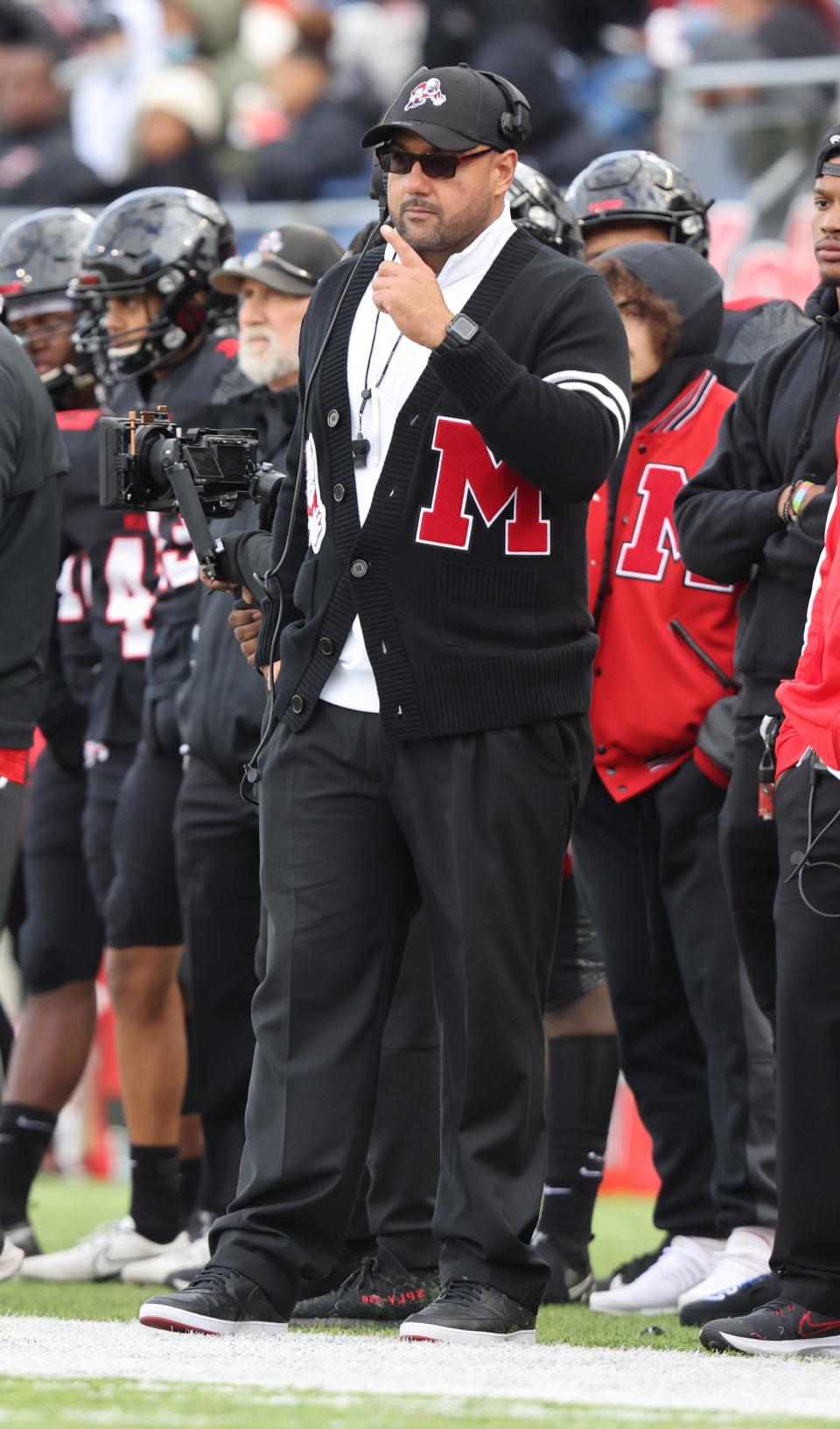 McKinley head coach Antonio Hall watches his team during an Oct. 23, 2021 high school football game against Massillon at Tom Benson Hall of Fame Stadium.