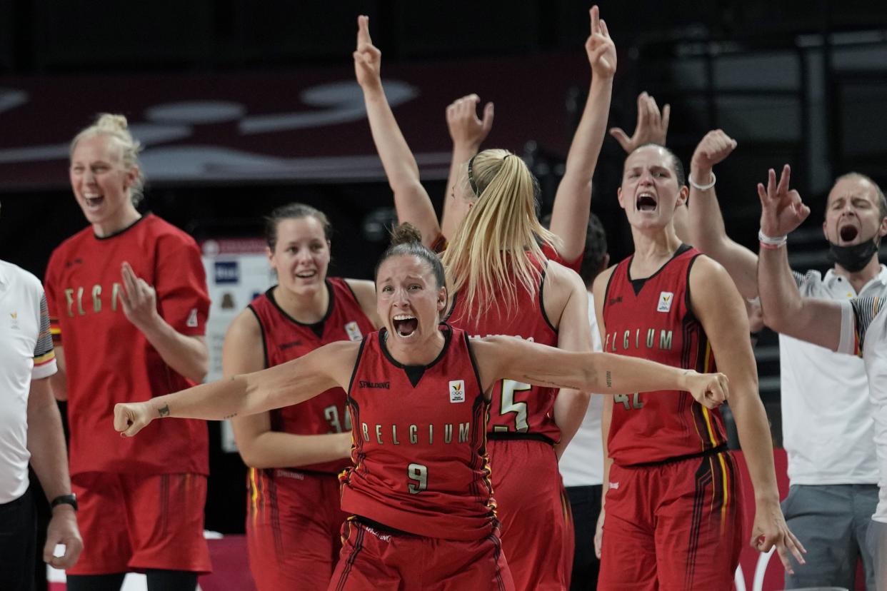 Belgium players celebrate their win over Australia in a women's basketball game at the 2020 Summer Olympics, Tuesday, July 27, 2021, in Saitama, Japan.