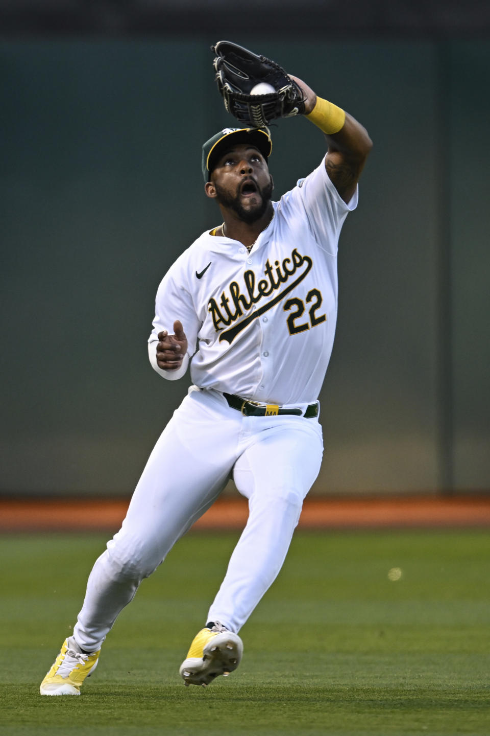 Oakland Athletics outfielder Miguel Andujar (22) catches a fly ball hit by the Los Angeles Angels during the fifth inning of a baseball game Tuesday, July 2, 2024, in Oakland, Calif. (AP Photo/Eakin Howard)