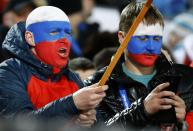 Russian fans cheer as they attend the men's ski jumping normal hill individual final event of the Sochi 2014 Winter Olympic Games, at the RusSki Gorki Ski Jumping Center in Rosa Khutor, February 9, 2014. REUTERS/Kai Pfaffenbach (RUSSIA - Tags: OLYMPICS SPORT SKIING POLITICS)