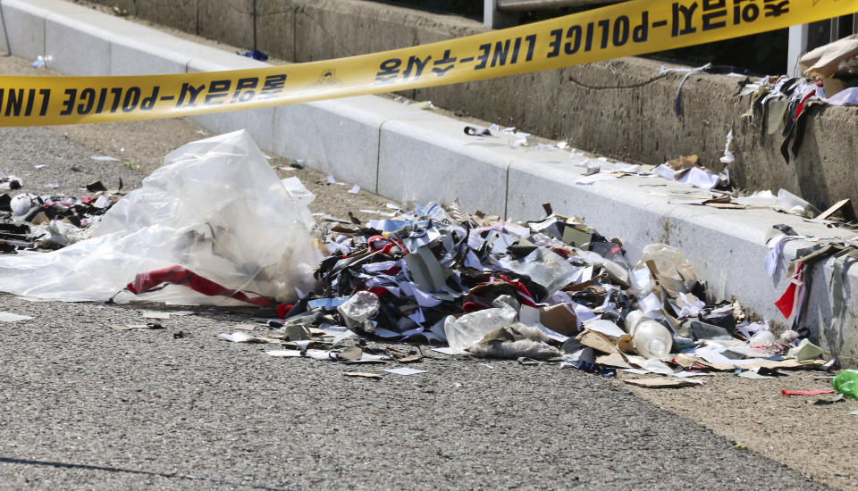 FILE - The trash from a balloon presumably sent by North Korea, is seen behind police tape in Incheon, South Korea, Sunday, June 2, 2024. South Korea has recently retaliated for North Korea's trash-carrying balloon launches with propaganda loudspeaker broadcasts at border areas. The South Korean broadcasts reportedly included K-pop sensation BTS’s mega hits like “Butter” and “Dynamite,” weather forecasts and news on Samsung as well as outside criticism on the North’s missile program.(Im Sun-suk/Yonhap via AP, File)