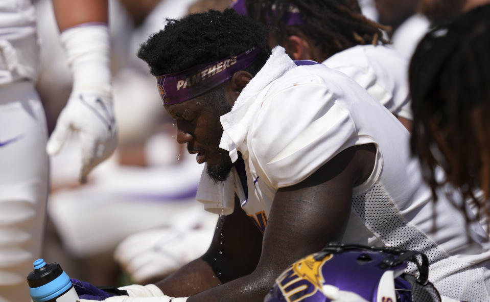 Water drips off Northern Iowa defensive lineman Cordarrius Bailey after pouring water on his head during the first half of an NCAA college football game against Iowa State, Saturday, Sept. 2, 2023, in Ames, Iowa. (AP Photo/Matthew Putney)