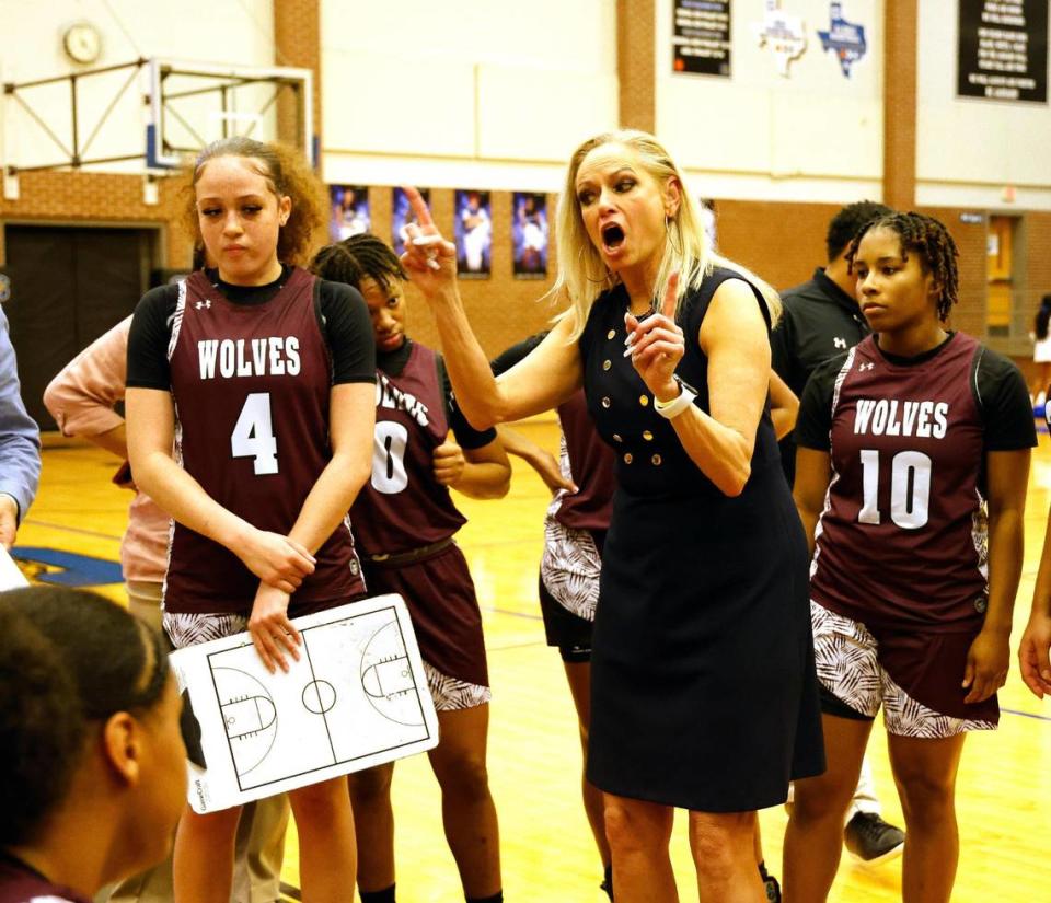 Timberview head coach Kit Martin talks to the team during a time out in the first half of a high school basketball game at Summit High School in Mansfield, Texas, Tuesday, Jan, 30, 2024.