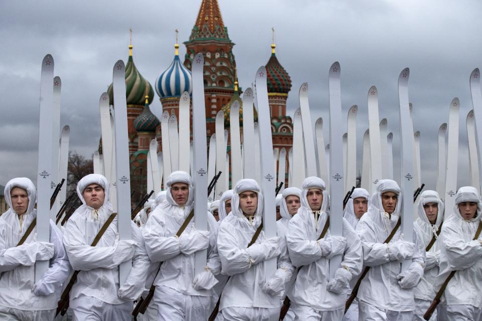 Russian soldiers dressed in Red Army World War II winter uniforms take a part in a reconstruction of a World War II-era parade in Moscow's Red Square with St. Basil Cathedral in the background, Russia, Thursday, Nov. 7, 2019. The Nov. 7, 1941 parade saw Red Army soldiers move directly to the front line in the Battle of Moscow, becoming a symbol of Soviet valor and tenacity in the face of overwhelming odds. (AP Photo/Alexander Zemlianichenko)