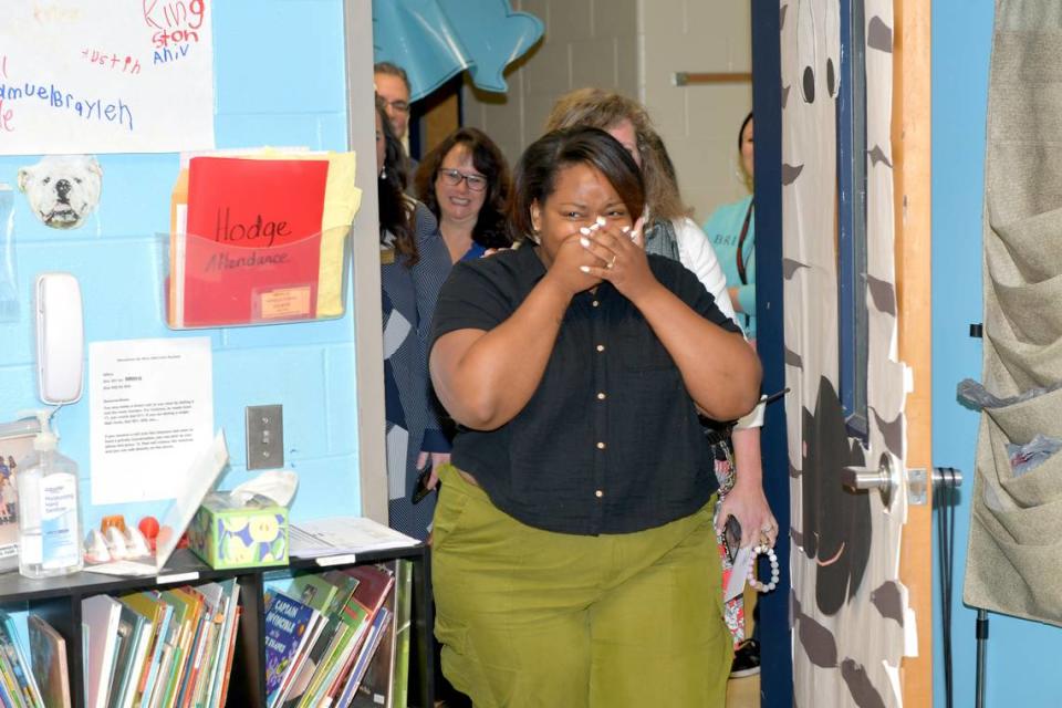Nicole Hodge of Britt David Magnet Academy reacts after she was surprised in her classroom March 14, 2024, with the announcement that she is among the three finalists for Muscogee County School District’s Teacher of the Year award.