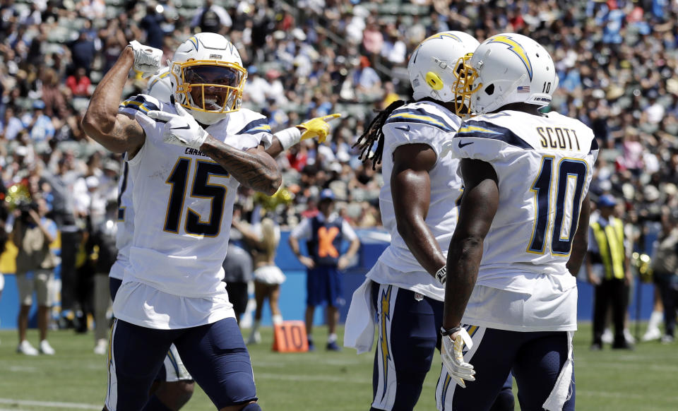 Los Angeles Chargers wide receiver Andre Patton (15) celebrates after a touchdown reception against the New Orleans Saints during the first half of a preseason NFL football game Sunday, Aug. 18, 2019, in Carson, Calif. (AP Photo/Gregory Bull )