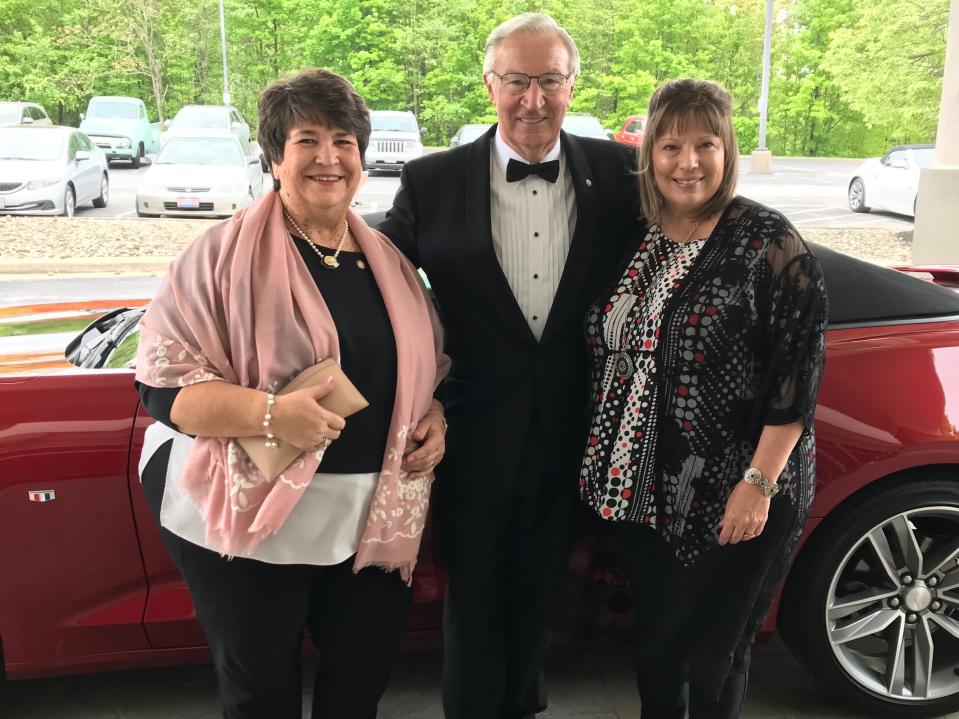 Pictured are Gala co-chairs Marilyn Orr (left) and Kris Barker with past chair Ron Strobl and a Camaro auction item at the last Rotary Gala.