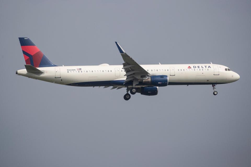 A Delta passenger plane gets ready to land at Detroit Metro Airport in Romulus on Friday, June 30, 2023.