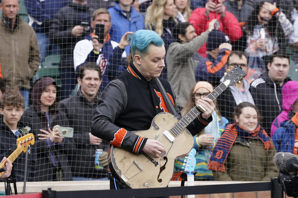 FILE - Musician Jack White performs the national anthem before the first inning of a baseball game between the Detroit Tigers and the Chicago White Sox, Friday, April 8, 2022, in Detroit. Fire destroyed a landmark restaurant and brewpub Friday, May 27, 2022, in Midtown Detroit, but spared the neighboring Third Man Records store owned by musician Jack White as well as Shinola's flagship watch store. (AP Photo/Carlos Osorio, File)