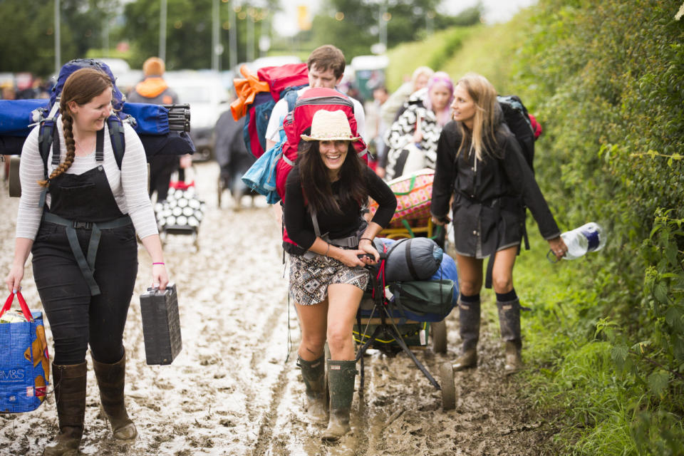 Keeping spirits up: Glasto-goers didn’t let the weather get the down. (SWNS)
