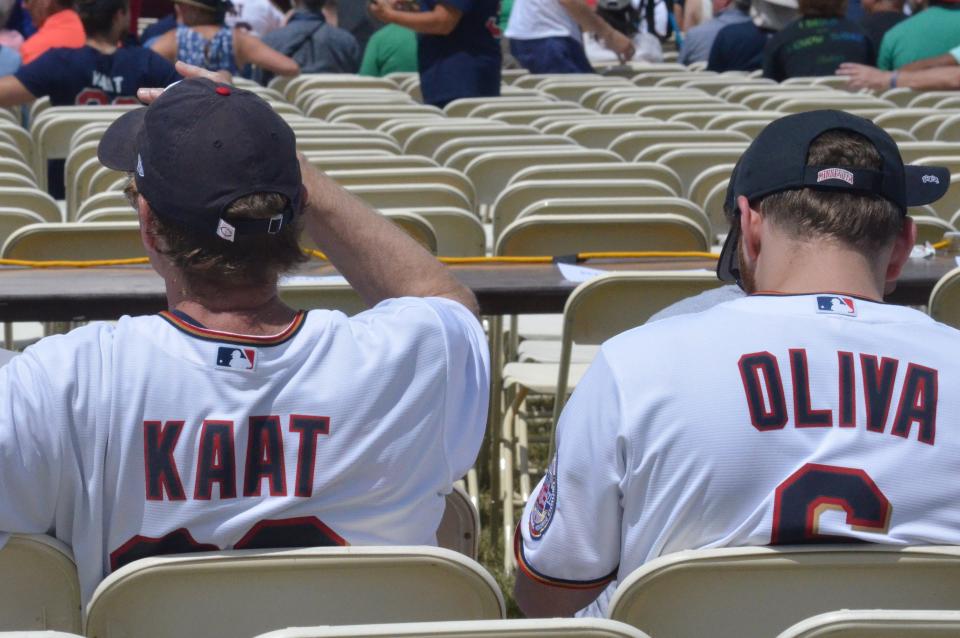 Fans wait for the induction ceremony wearing Jim Kaat and Tony Oliva jerseys.