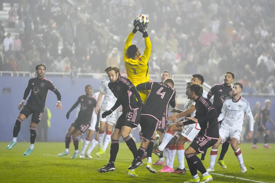 Inter Miami goalkeeper Drake Callender (1) goes up to make a save against FC Dallas during the second half of a preseason friendly MLS soccer match, Monday, Jan. 22, 2024, at the Cotton Bowl in Dallas. FC Dallas won 1-0. (AP Photo/Julio Cortez)