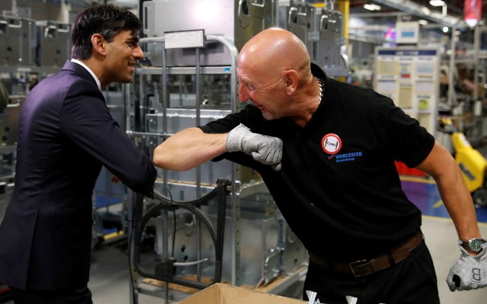 Rishi Sunak greets an employee during a visit to the Worcester Bosch factory - Phil Noble/PA