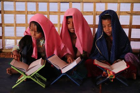 Young Rohingya refugees learn to recite the Koran in an Arabic school at Palongkhali makeshift refugee camp in Cox's Bazar, Bangladesh, November 7, 2017. REUTERS/Mohammad Ponir Hossain