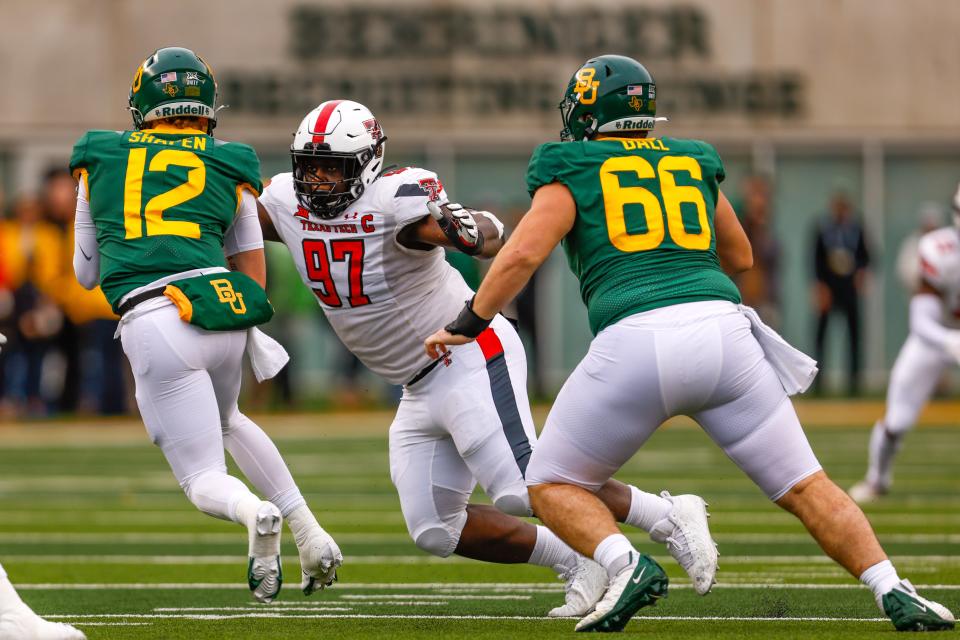 Texas Tech defensive tackle Tony Bradford (97) closes in for a tackle during a 2021 game at Baylor. Bradford has been credited with 134 tackles in his career, including 29 tackles for loss with 14 sacks.