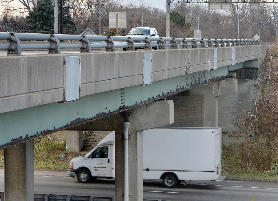 Traffic moves on the eastbound bridge, top, carrying Route 20, or West 26th Street, over Interstate 79 on Thursday in Erie. State-owned bridges in Erie County might be eligible for the new federal infrastructure funding.