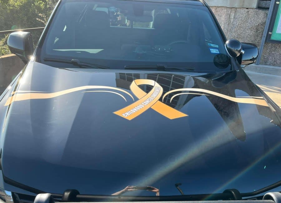 car with ribbon graphic