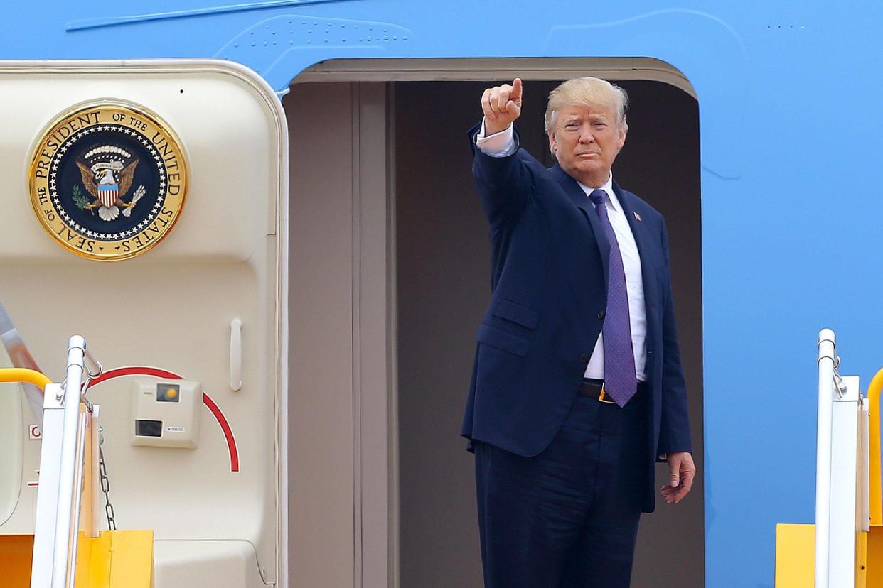 US President Donald Trump gestures as he boards Air Force One: Minh Hoang/AFP/Getty