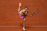 Aryna Sabalenka, of Belarus, returns the ball to Magda Linette, of Poland, during the Mutua Madrid Open tennis tournament in Madrid, Friday, April 26, 2024. (AP Photo/Manu Fernandez)