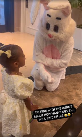 <p>Instagram/missbbell</p> Powerful Queen Cannon talking to an Easter bunny
