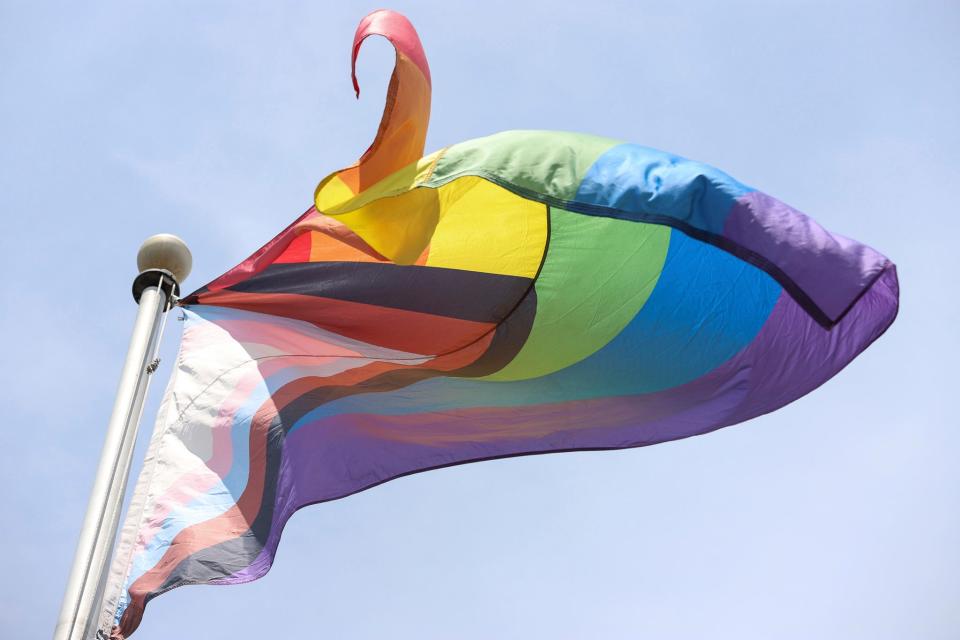 LGBTQ pride flag waves along Jos Campau in Hamtramck on Sunday, July 9, 2023. 