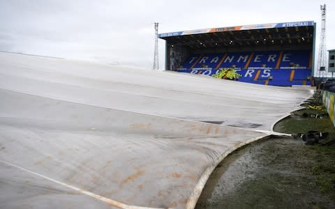  A general view as the pitch is covered prior to the FA Cup Fourth Round match between Tranmere Rovers and Manchester United - Credit: GETTY IMAGES