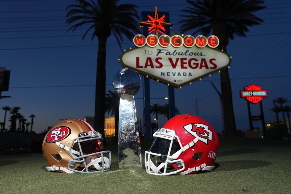 Jan 30, 2024; Las Vegas, NV, USA; San Francisco 49ers and Kansas Chiefs helmets and the Vince Lombardi trophy at the Welcome to Fabulous Las Vegas sign. Mandatory Credit: Kirby Lee-USA TODAY Sports