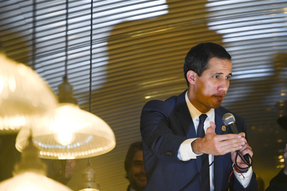 Leader of Venezuela's political opposition Juan Guaido gives a speech in a restaurant in the Bethnal Green area of London, Tuesday, Jan. 21, 2020. (AP Photo/Alberto Pezzali)