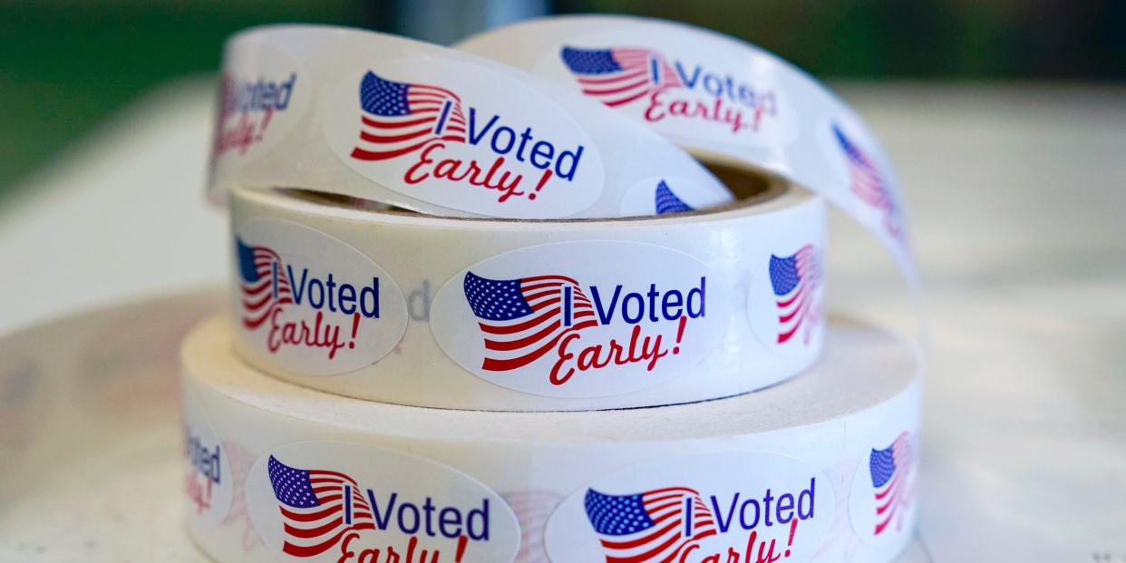 Early voting sticker rolls on a table