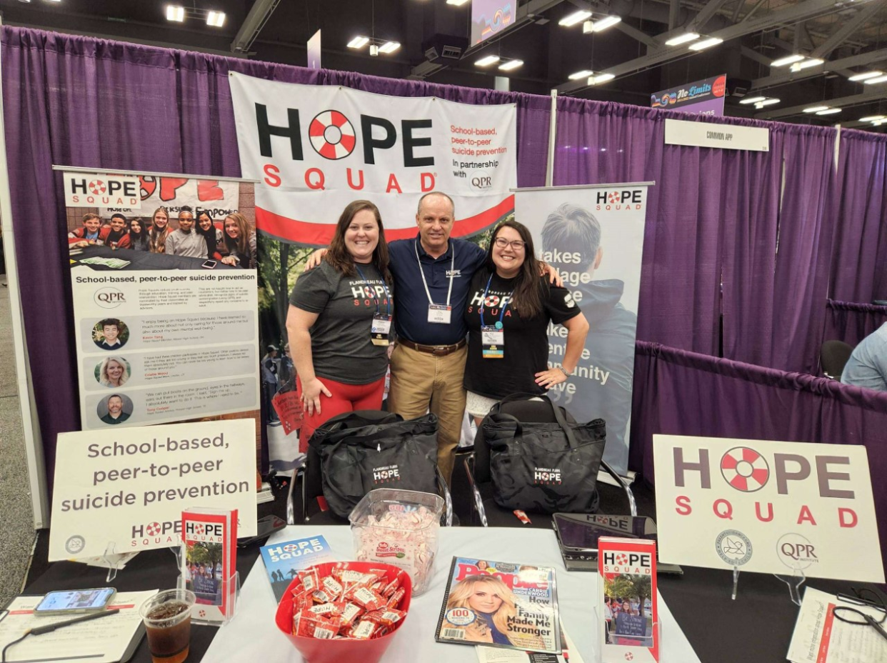 Flandreau Hope Squad advisers Chelsea Greenfield (left) and Kari Lena-Helling with Hope Squad founder Greg Hudnall at the 2022 American School Counselor Association Conference in Austin, Texas.