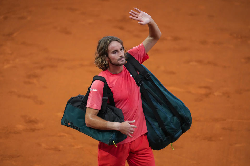 FILE - Stefanos Tsitsipas, of Greece, waves to supporters after a match against Thiago Monteiro, of Brazil, during the Mutua Madrid Open tennis tournament in Madrid, Saturday, April 27, 2024. Paula Badosa says she and Stefanos Tsitsipas are no longer a love match. The tennis power couple has broken up. Badosa wrote on social media Sunday, May 5, 2024, that the pair “decided to amicably part ways” after being a couple since last year. (AP Photo/Manu Fernandez, File)