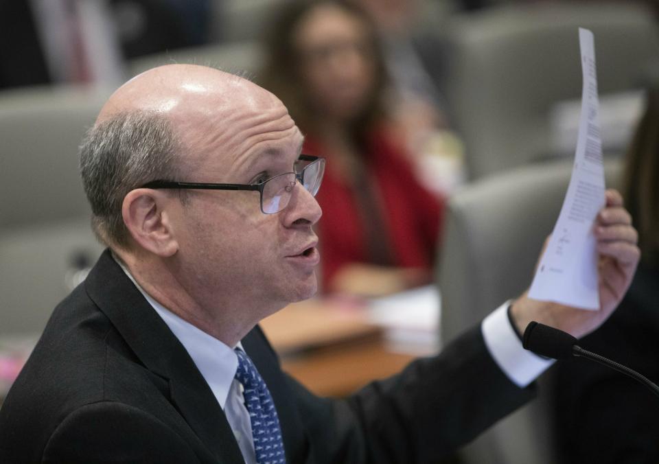 Marc Elias, an attorney for Democratic congressional candidate Dan McCready, expresses frustration after new documents were entered into evidence during the fourth day of a public evidentiary hearing on the 9th Congressional District voting irregularities investigation Thursday, Feb. 21, 2019, at the North Carolina State Bar in Raleigh. (Travis Long/The News & Observer via AP)