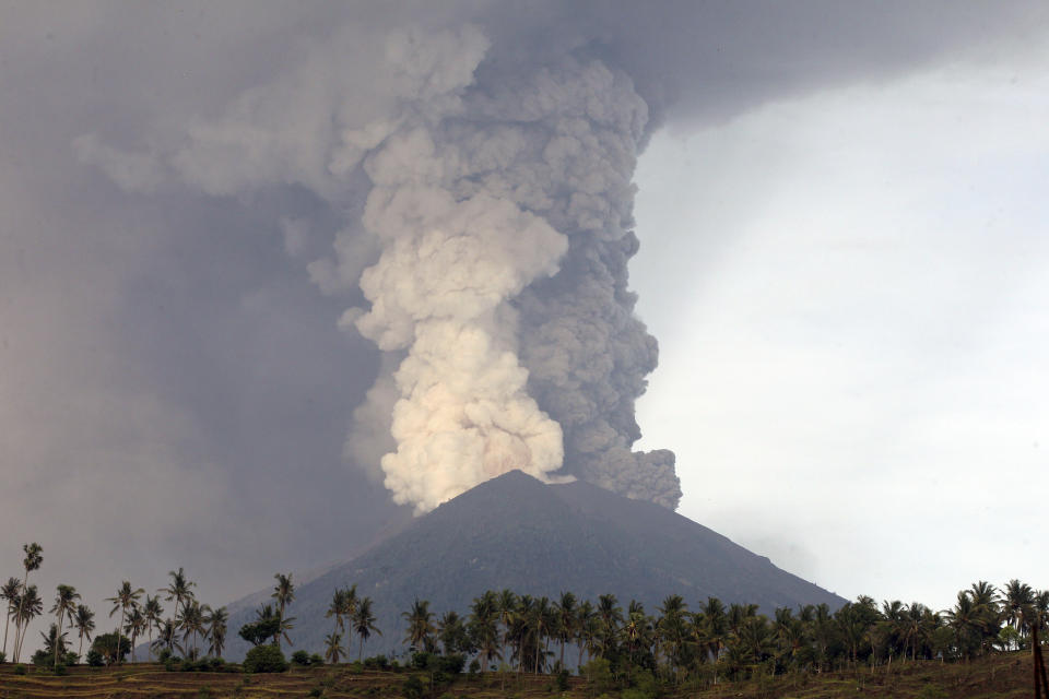 <p>A view of the Mount Agung volcano erupting in Karangasem, Bali, Indonesia, Nov. 27, 2017. The volcano on the Indonesian tourist island of Bali erupted for the second time in a week on Saturday, disrupting international flights even as authorities said the island remains safe. (Photo: Firdia Lisnawati/AP) </p>