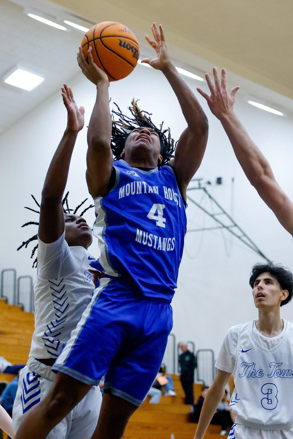 Mountain House High’s Cedrick Major(4) fights down low during its 62-41 win against Atwater High at the Super Saturday Showcase event, held at Blanchard Gymnasium on the Delta College campus in Stockton, CA