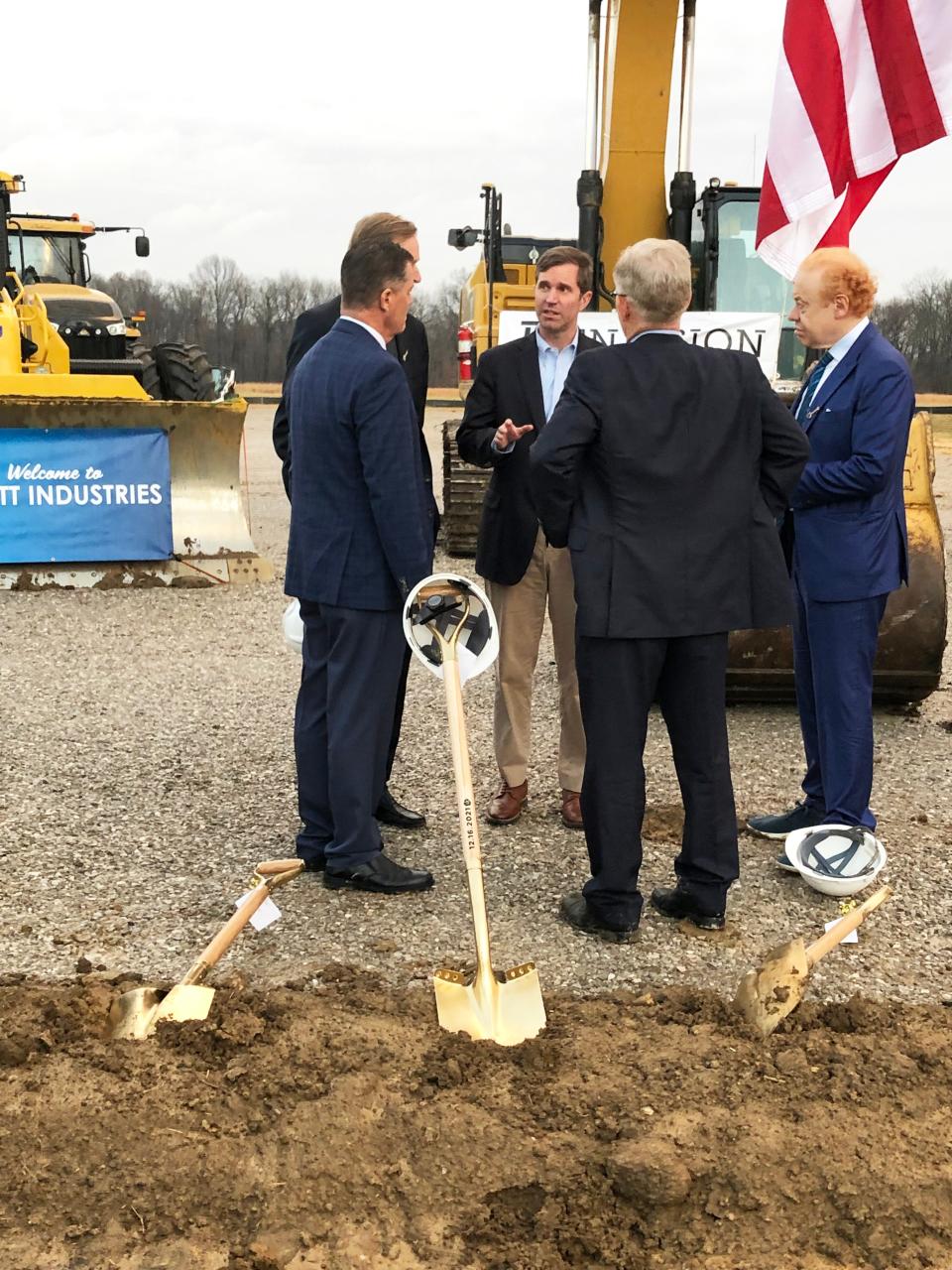 Gov. Andy Beshear, center, chats with Pratt Industries Executive Chairman Anthony Pratt, far right, and other company executives following the ceremonial groundbreaking Thursday for the company’s $500 million paper recycling and corrugated box manufacturing complex on Henderson’s Kentucky 425/South Bypass.