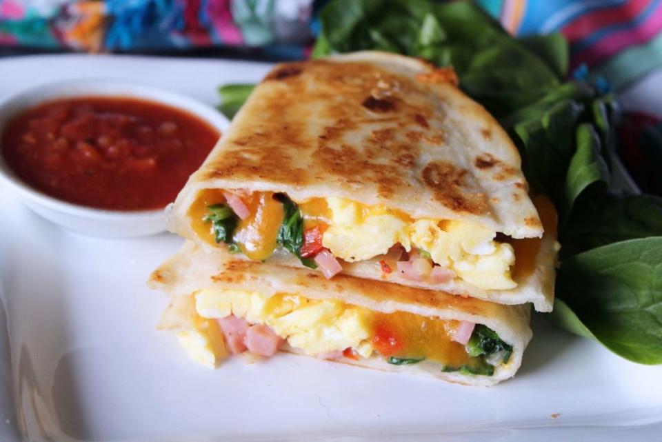 <p>Baked Broiled and Basted</p><p>This quesadilla will definitely have dad ready to start his special day.</p><p><strong>Get The Recipe: <a href="https://bakedbroiledandbasted.com/brunch-quesadillas/" rel="nofollow noopener" target="_blank" data-ylk="slk:Brunch Quesadillas;elm:context_link;itc:0;sec:content-canvas" class="link ">Brunch Quesadillas</a></strong></p>