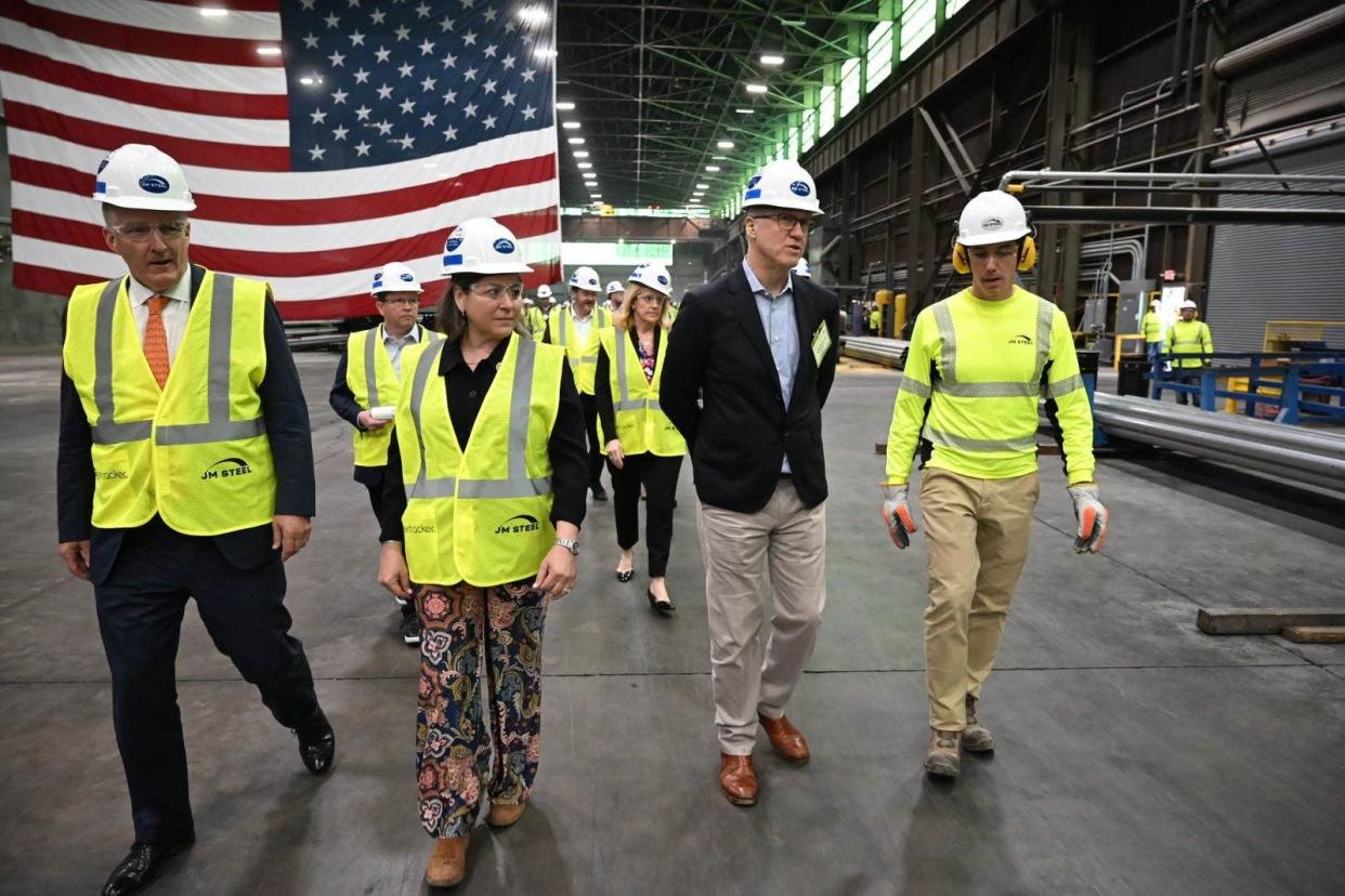 Event attendees explore the JM Steel plant in Leetsdale on April 26, 2024. At the event, officials announced they would be adding production lines and an additional workforce to accommodate the demand for steel torque tubes for large-scale solar arrays.