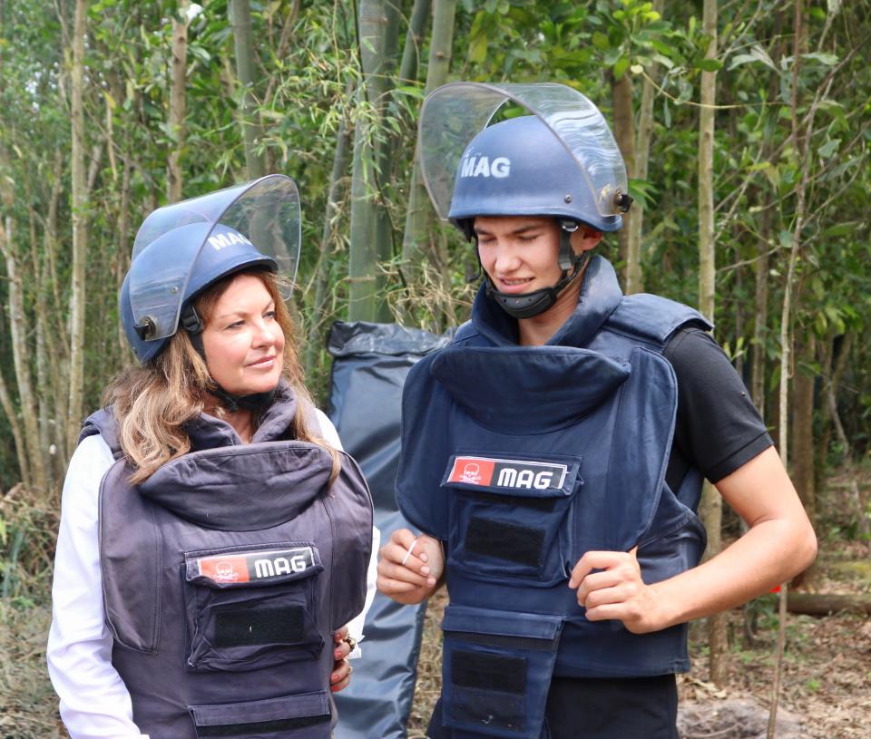 Roots of Peace founder Heidi Kühn with her son Christian in Quang Tri, Vietnam, with the Mines Advisory Group. The group aided in detonating land mines remaining from the Vietnam War, clearing the way for farmers to use the land.