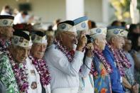 Pearl Harbor survivor Ewalt Schatz takes a picture as the USS Halsey gets ready to pass the Arizona Memorial during the 72nd anniversary of the attack on Pearl Harbor at the WW II Valor in the Pacific National Monument in Honolulu, Hawaii on December 7, 2013. (REUTERS/Hugh Gentry)