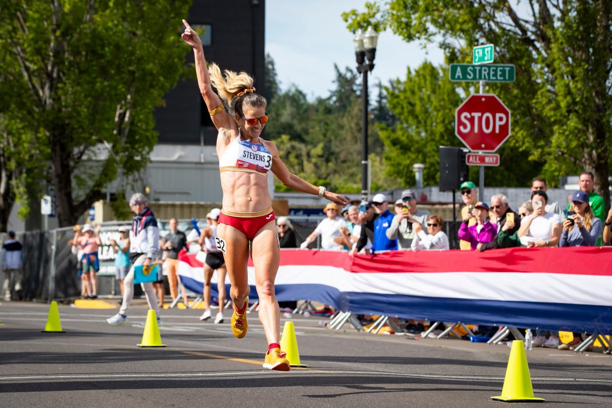 Robyn Stevens jumps as she crosses the finish line to win the 20K race walk on day nine of the U.S. Olympic Track & Field Trials Saturday, June 29, 2024, in downtown Springfield, Ore.