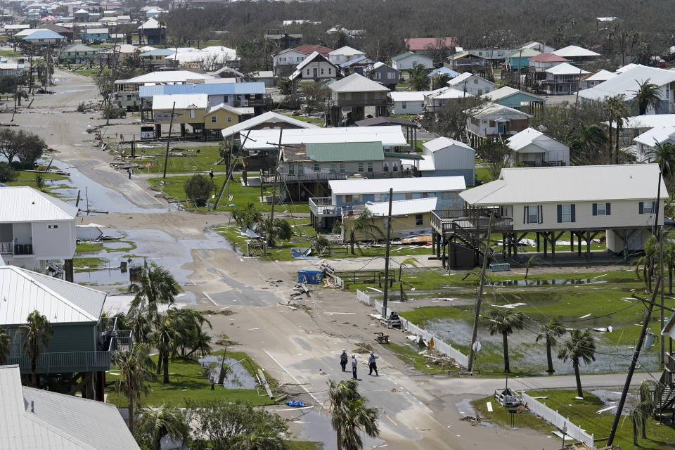 The remains of destroyed homes and businesses are seen in the aftermath of Hurricane Ida in Grand Isle, La., Tuesday, Aug. 31, 2021. (AP Photo/Gerald Herbert)