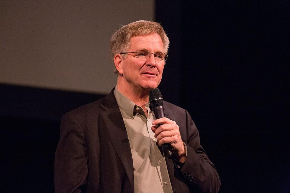 Travel author and TV personality Rick Steves speaks on stage at The Paramount Theatre in Austin, Texas.