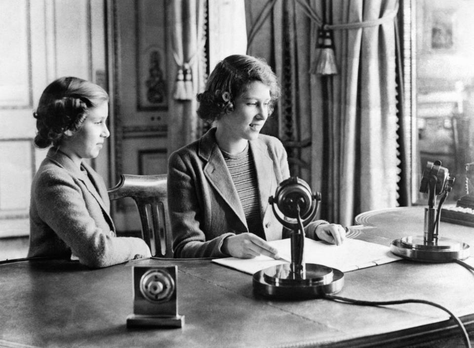 A wartime picture of Princess Elizabeth, right, and Princess Margaret after their broadcast on Children’s Hour from Windsor Castle (PA)