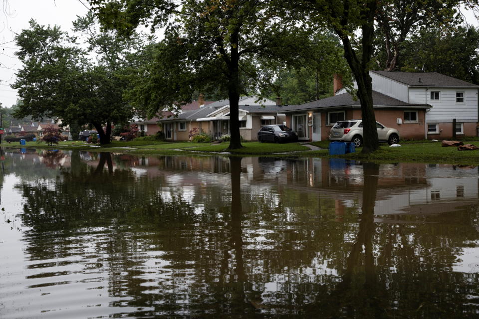 Water floods Hanover Street in Dearborn Heights, Mich., leaving residents unable to leave their homes after heavy rains in July.