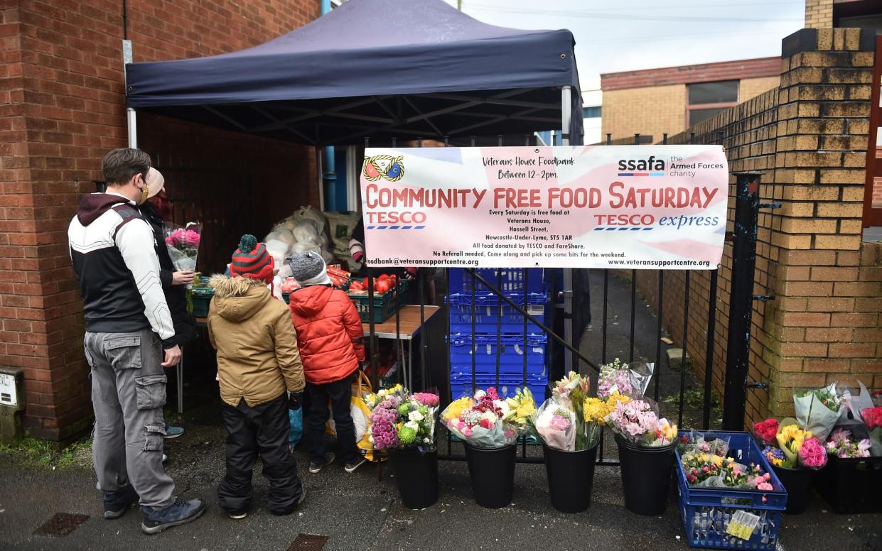 A family collect food from a support centre in Newcastle-under-Lyme