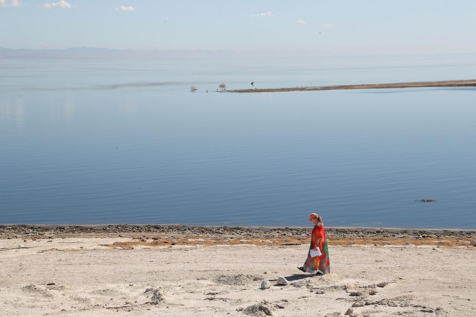 Rev. Jane Voigts of the United Methodist Church in Palm Springs takes a spiritual walk along the shoreline of the Salton Sea in Desert Shores, Calif., Oct. 10, 2022. "There's a lot of interest in the lithium mining, that would be very green, that would bring i lot of income and business.  I keep praying that that might be one of the real solutions."