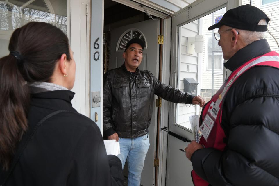 Santo Mesa talks and Dave Marcus, Disaster Action Team Supervisor with the Red Cross into his apartment where a smoke detector was checked and changed. The Dover fire department and the New Jersey Red Cross organized volunteers then went door to door in selected Dover neighborhoods to offer free smoke detector inspections and installations on March 25, 2023.