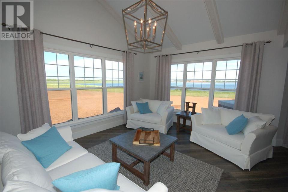 <p><span>296 Macmillan Point Road, West Covehead, P.E.I.</span><br> The home sits on 1.1 acres overlooking Covehead Bay, Stanhope Golf Course, sand dunes and the ocean.<br> (Photo: Zoocasa) </p>